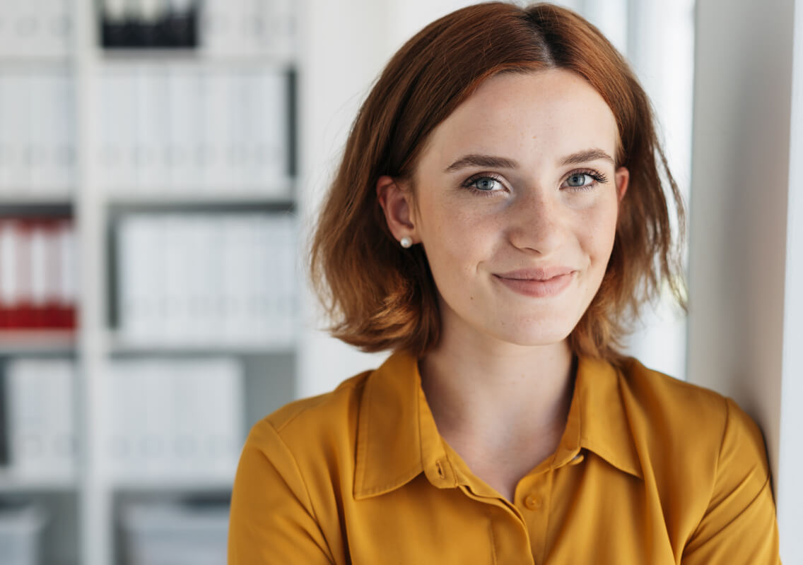 woman-by-office-window-content