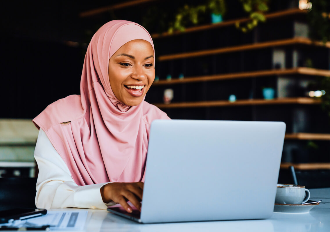 woman-laptop-video-call-in-cafe